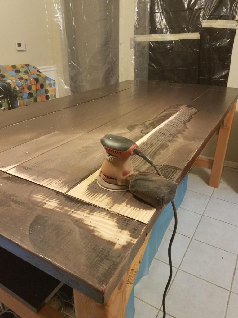 photograph of a sander and the table just as it was beginning to get sanded