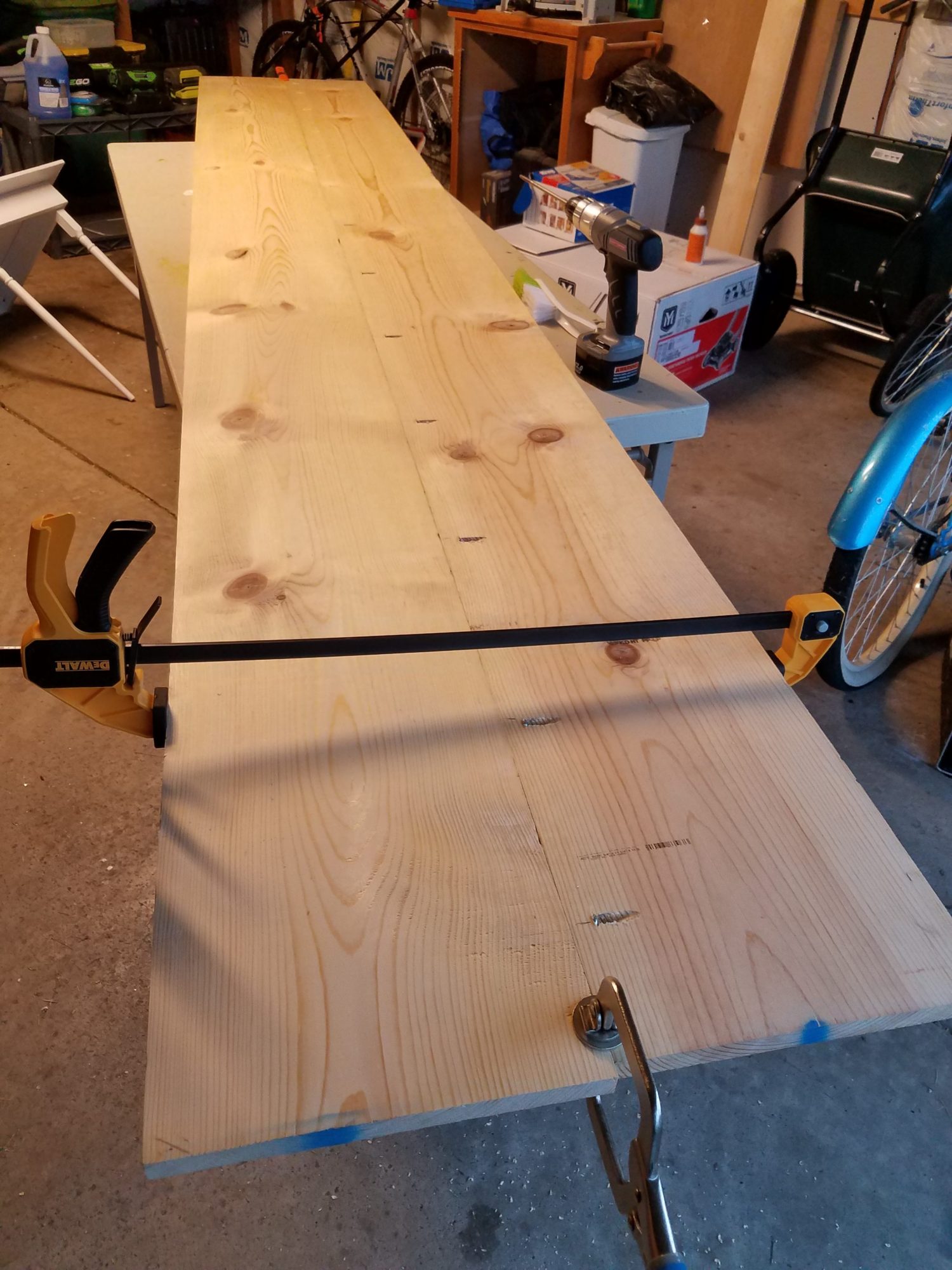 In order to make the desktop, we glued and screwed two boards together.